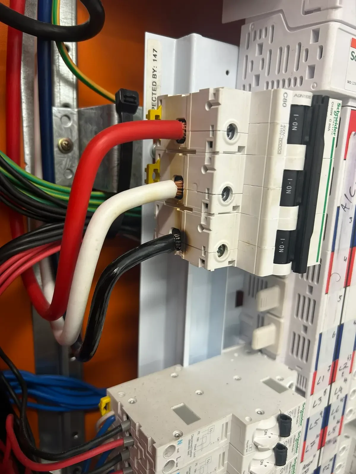 Burnt main switchboard after a commercial main switch failure in brisbane