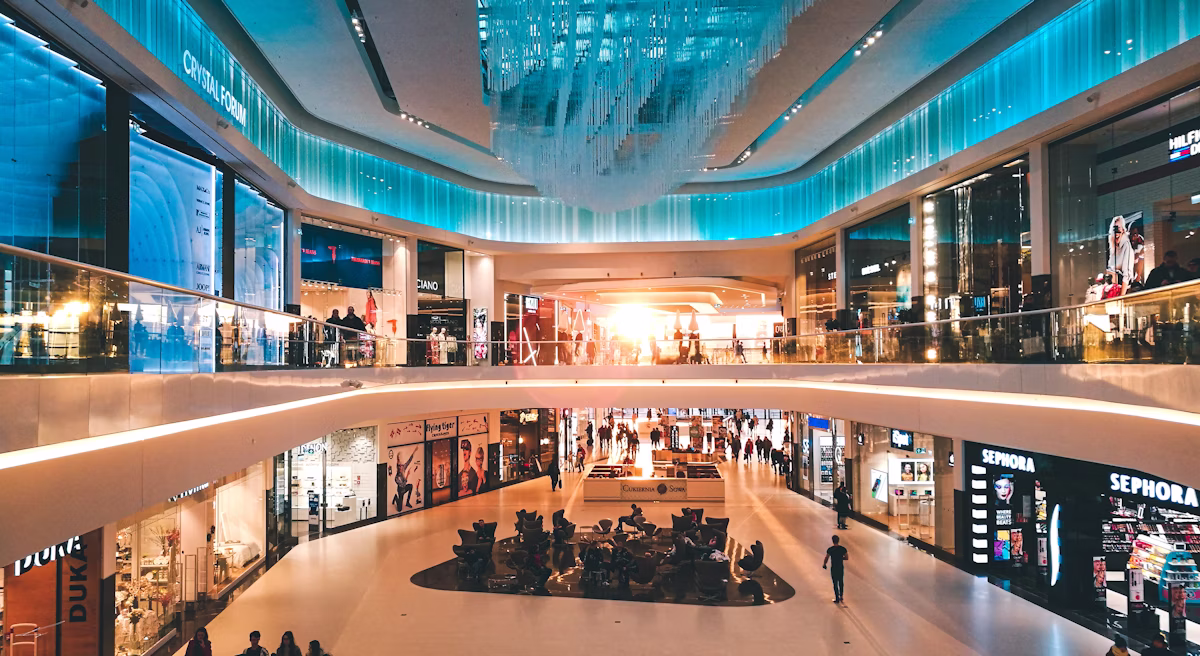 Multi-level shopping centre interior with tenancies relying on commercial switchboards