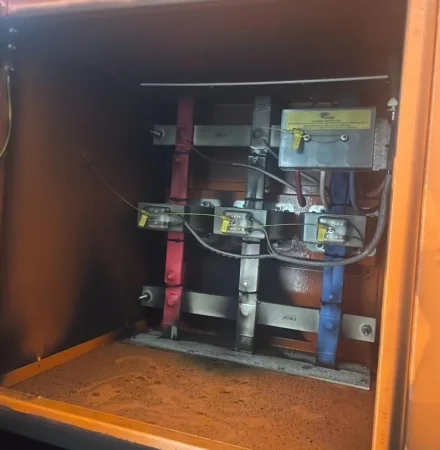 Burnt 1600a ct chamber inside commercial switchboard showing fire damage from un-coordinated maintenance
