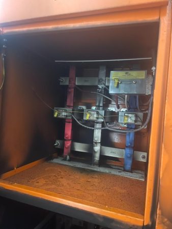Failed 800a load isolator chamber with heat damage at mount cotton iga